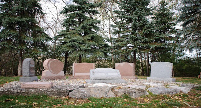 A photo of 6 gravestones